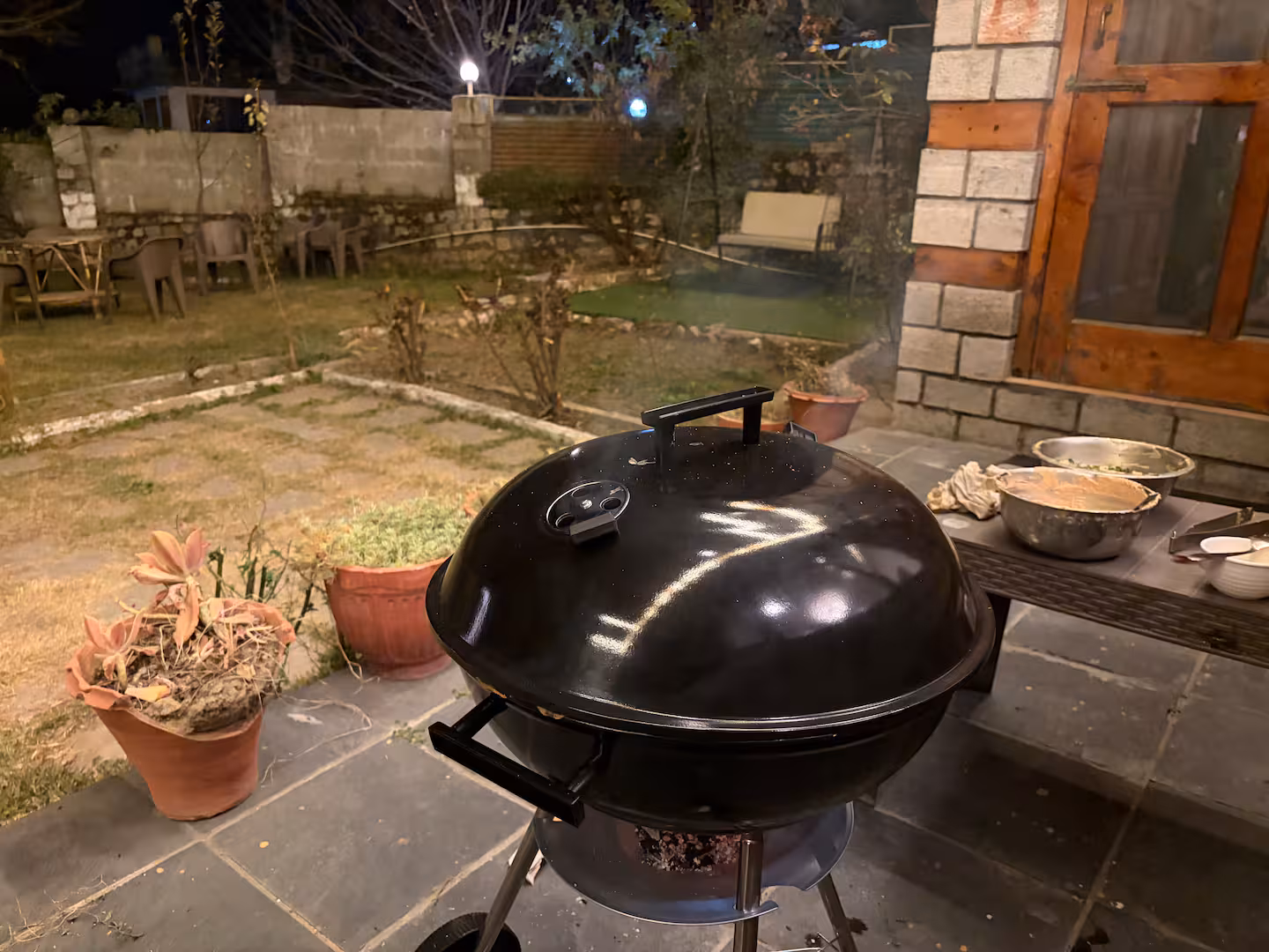 Charcoal BBQ grill set up on the terrace at Polaris Himalayan Chalet, Simsa, Manali