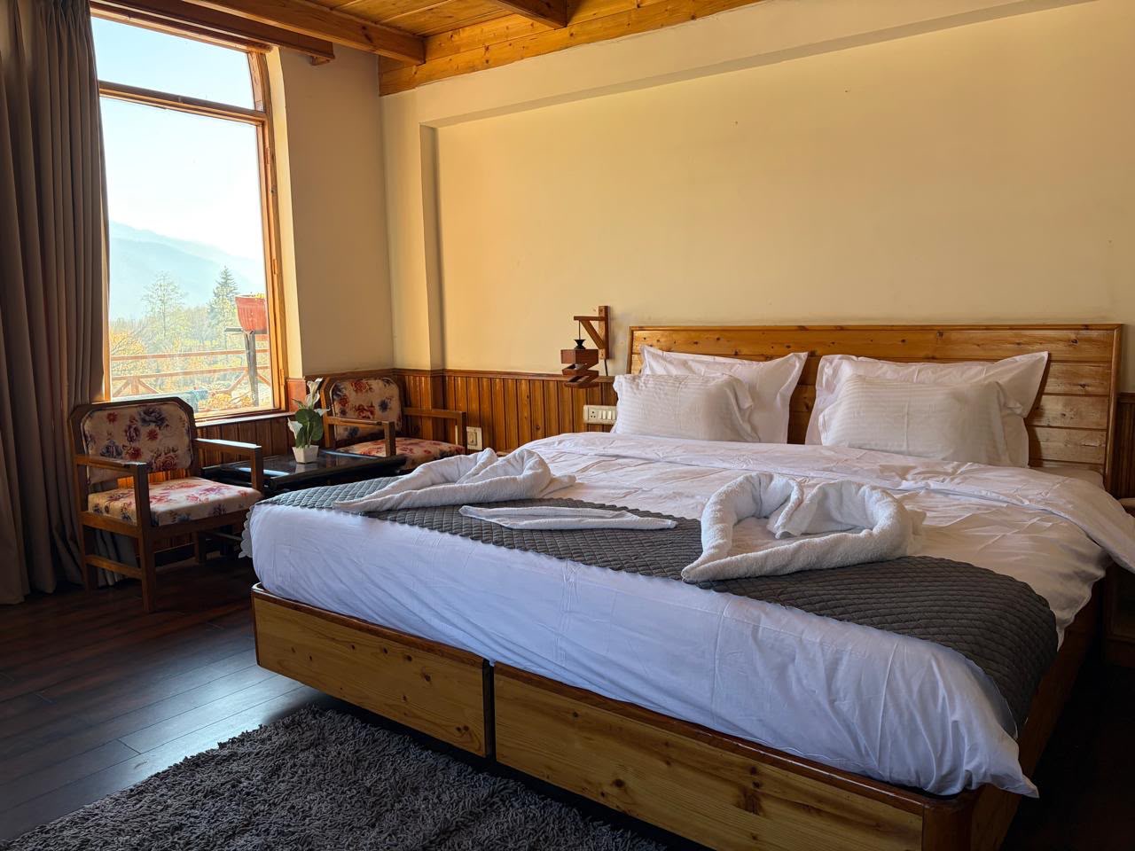 Valley-facing bedroom at a Polaris Collection stay