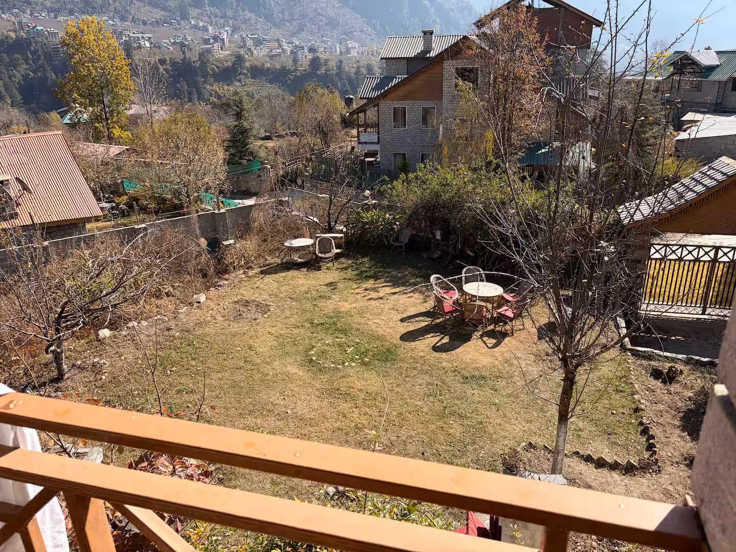 Private lawn with garden seating and valley outlook at Polaris Himalayan Chalet, Simsa, Manali